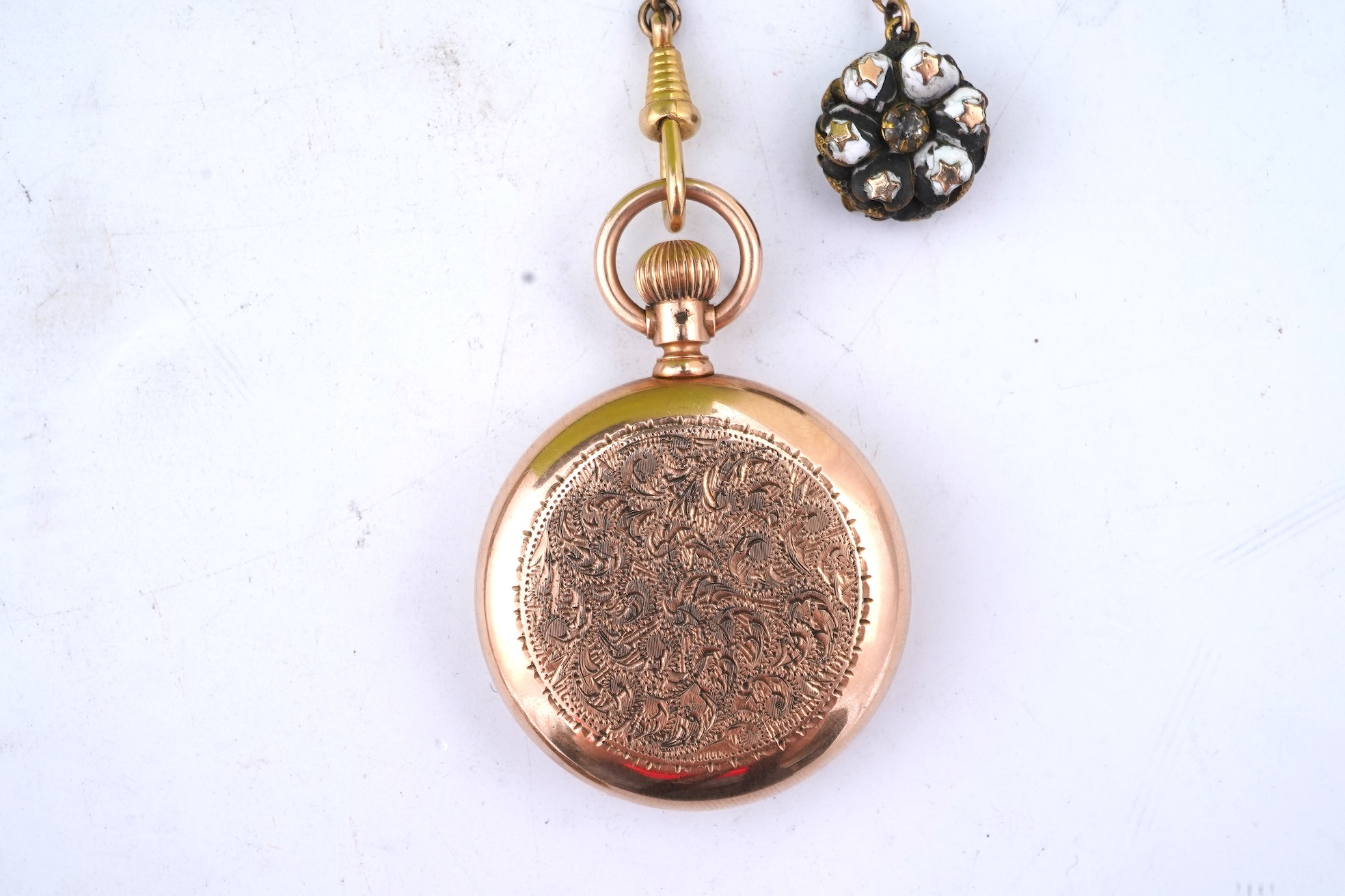 A group of gilt metal/pinchbeck jewels, 19th and early 20th century, comprising: a brooch of knotted design; two gate bracelets; a fancy link bracelet; an open-faced pocket watch; two oval panel brooches, and two watch c